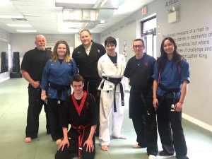 Overcoming Adversity - Black Belt Instructors plus a student
